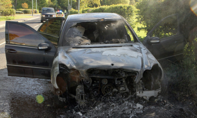 The Mercedes C200 was destroyed in the fire.