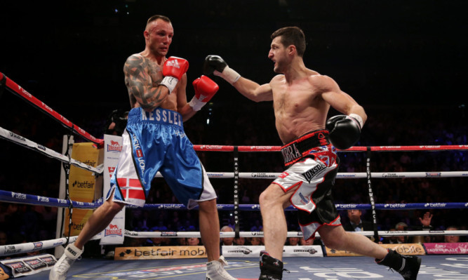 Carl Froch (right) in action with Mikkel Kessler during their IBF Middleweight Championship fight at the O2 Arena.