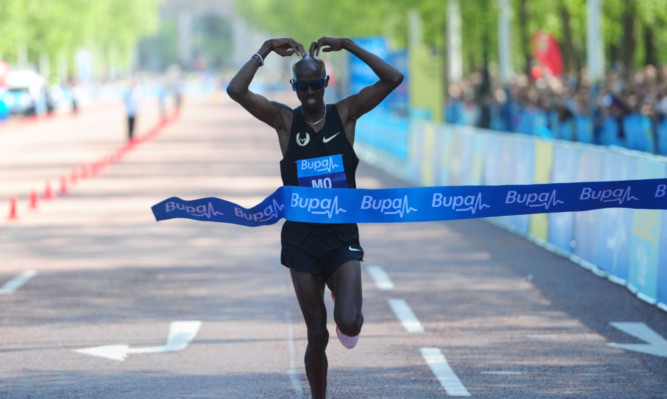 Mo Farah crosses the line to win the Bupa London 10k.