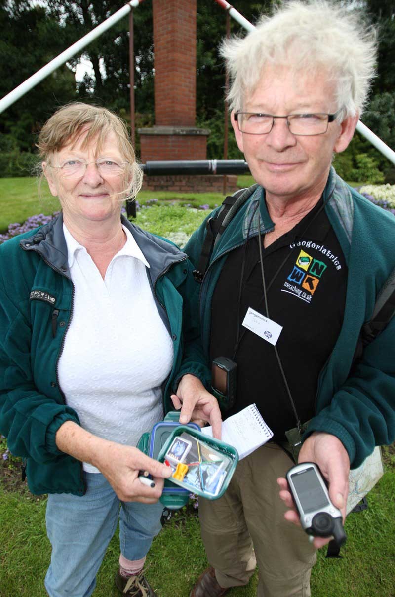 Kris Miller, Courier, 31/07/10, News. Picture today at Dewars centre, Perth. Pic shows Elizabeth and John Harvey (from Stockport) with one of the caches that was hidden near Dewars, some 1400 people travelled to Perth for the Mega Geocaching event.