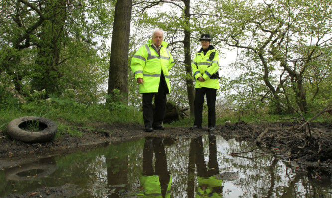 Constable Kristen Bellingham and Councillor Jim Young inspecting the damage caused by off-road bikers.