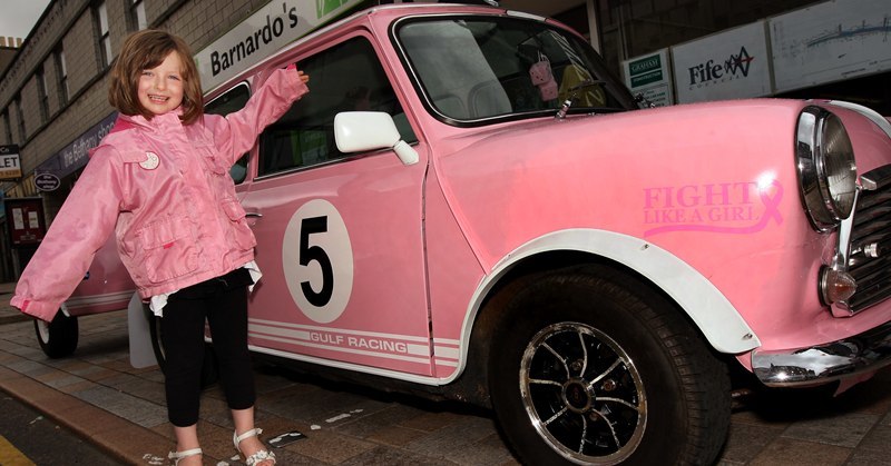 John Stevenson, Courier,31/07/10.Fife.Kirkcaldy,High Street,Summer Festival,pic shows five year old Jade Channon as she says this lovely pink Mini is the same colour as my jacket..