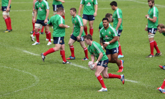 Stuart Hogg runs with the ball during the Lions training session at the Aberdeen Sports Ground in Hong Kong.