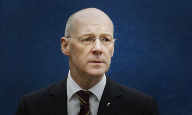 Finance secretary John Swinney will neither confirm nor deny whether the Government will seek an opinion on an independent Scotlands credit rating.
