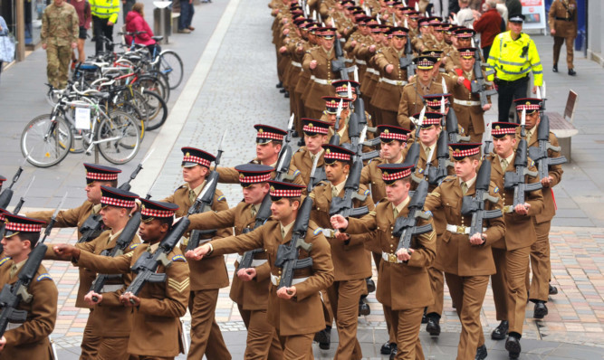 Soldiers from 1st Battalion Scots Guards parade through Inverness.