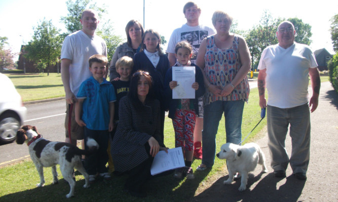 Gail Milne, front, and residents of Meadowfield and Moray Way North who have signed the petition.