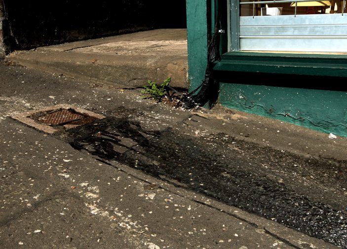 John Stevenson, Courier,03/08/10.Dundee.Raw sewage story.Pic shows the raw sewage which is seeping from a drain outside the shop New 4 You on the Hilltown.This has been an ongoing situation for some time despite being reported has not been repaired.