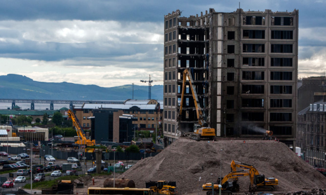 A view of what is left of Tayside House as the Muncher gets to work.