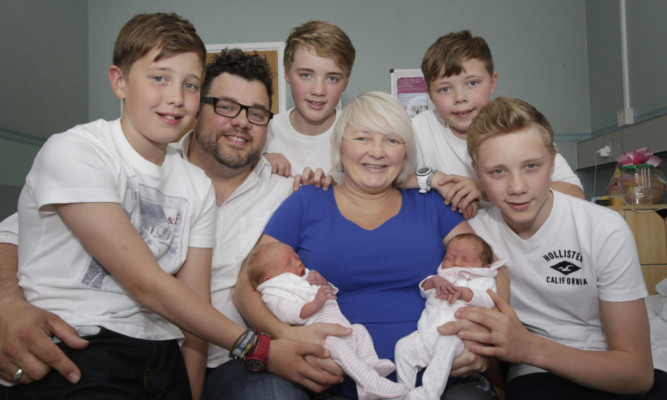 Karen and Colin with Rowan, left, and Isla and sons, from left, Finn, Lewis, Jude and Kyle.