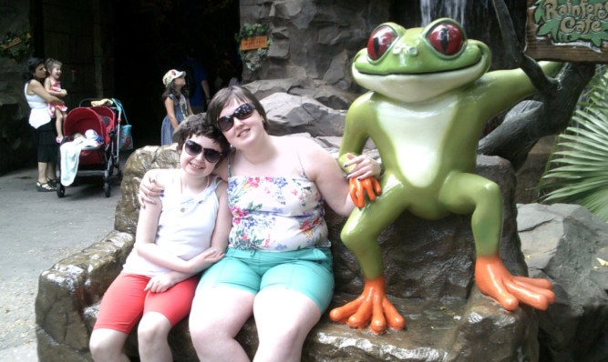 The girls with a friend soaking up the sun at Disneys Animal Kingdom in Florida.