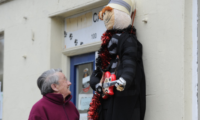 Betty Grant admies the 'Cat Shop' entry on the High Street.