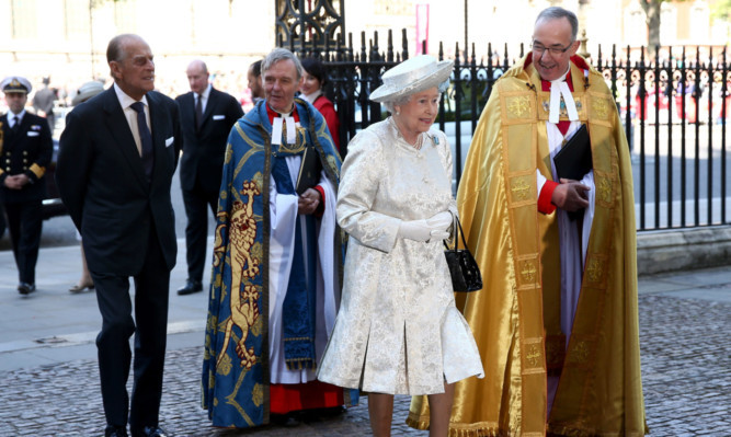 Queen Elizabeth II arrives with Prince Philip, Duke of Edinburgh and Dean of Westminster, The Very Reverend Dr John Hall.