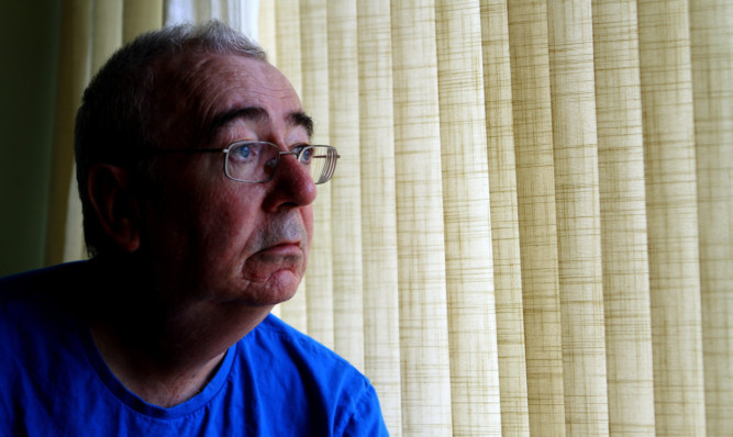 Angered by response of doctors surgery: diabetic patient John McHugh at home in Broughty Ferry.