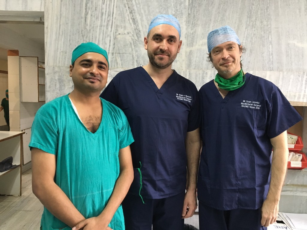 Surgeon Sean Laverick flanked by local surgeons Shakir Mustatfa and Mehul Jaisanian Laverick 