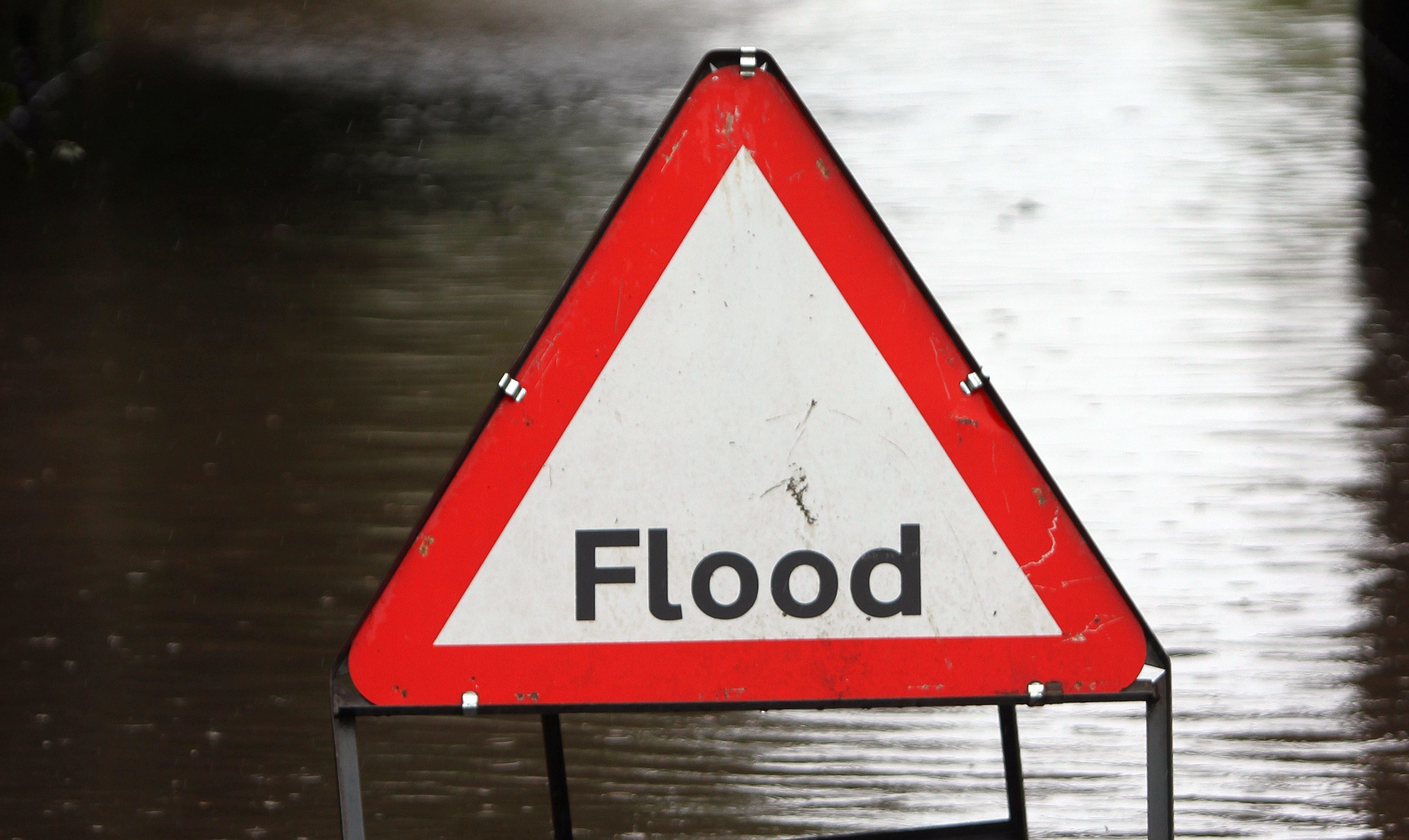 Blockages of a burn caused flooding and a wall to collapse.