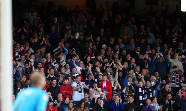 Dundee fans at a local derby in previous years.