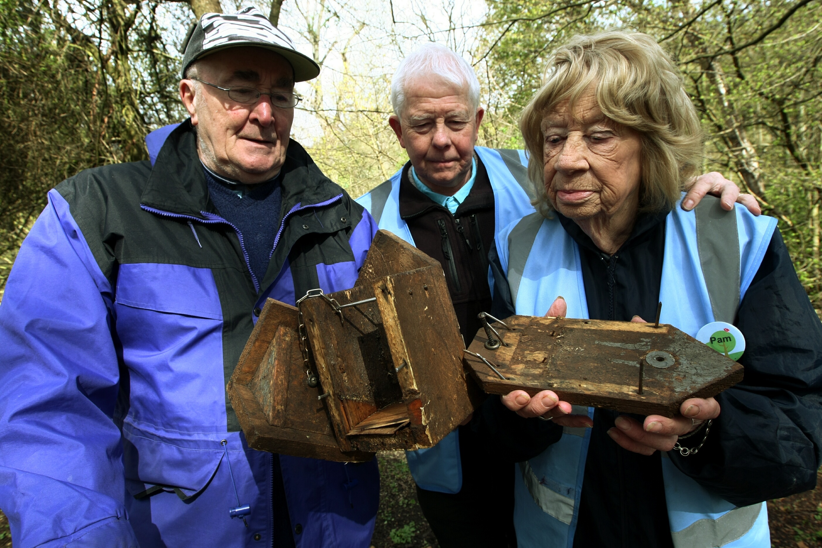 Friends Of Riverside Park volunteers Chris Clarke, David Cooper and Pam Hortin with the vandalised bird feeders.