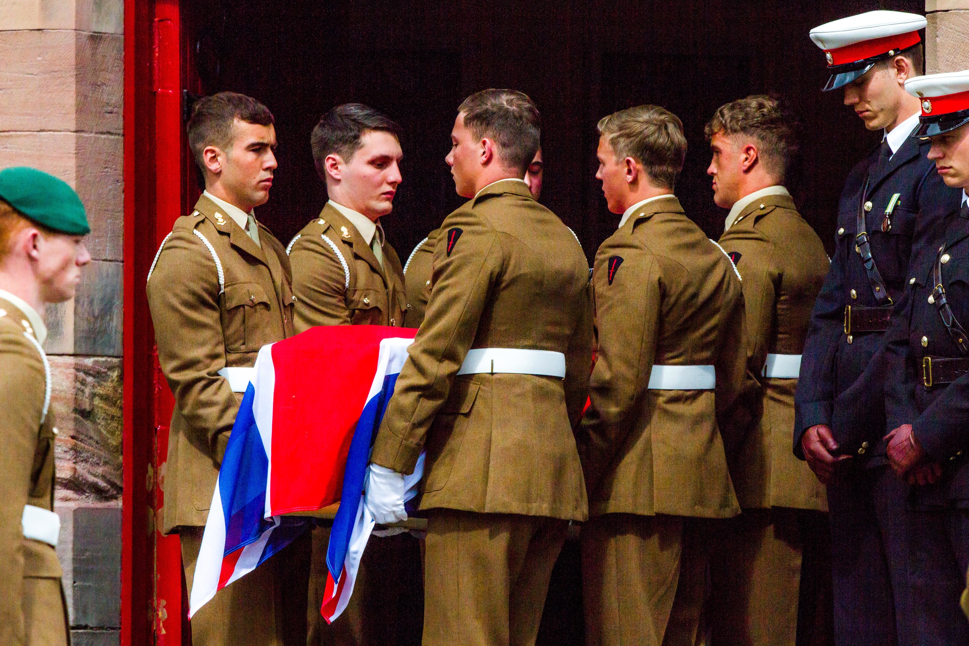 Captain Seath's coffin is carried by some of his fellow servicemen.