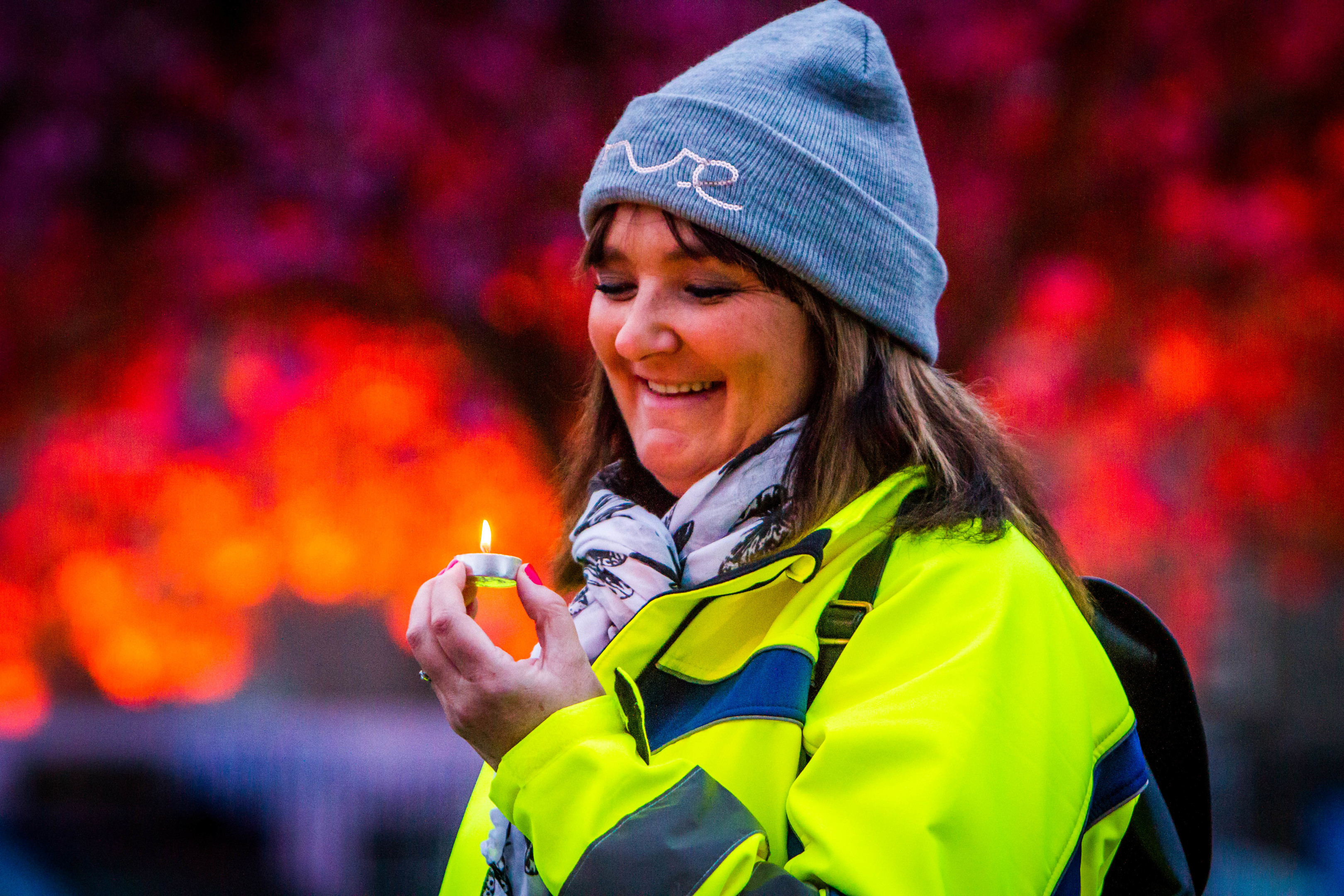 Organiser Tracy Swan lights a candle.