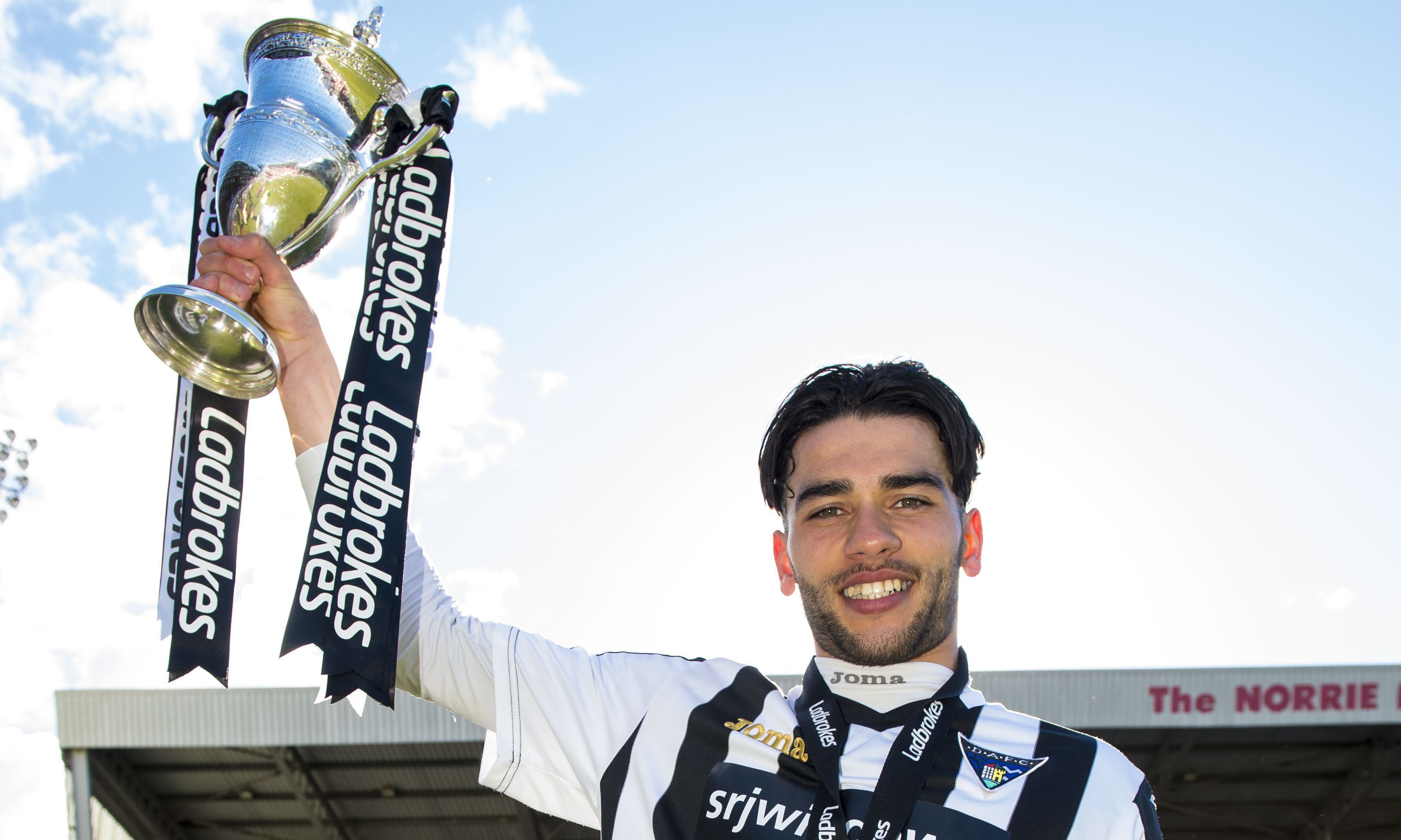 Faissel El Bahkatoui with the Ladbrokes League One trophy.