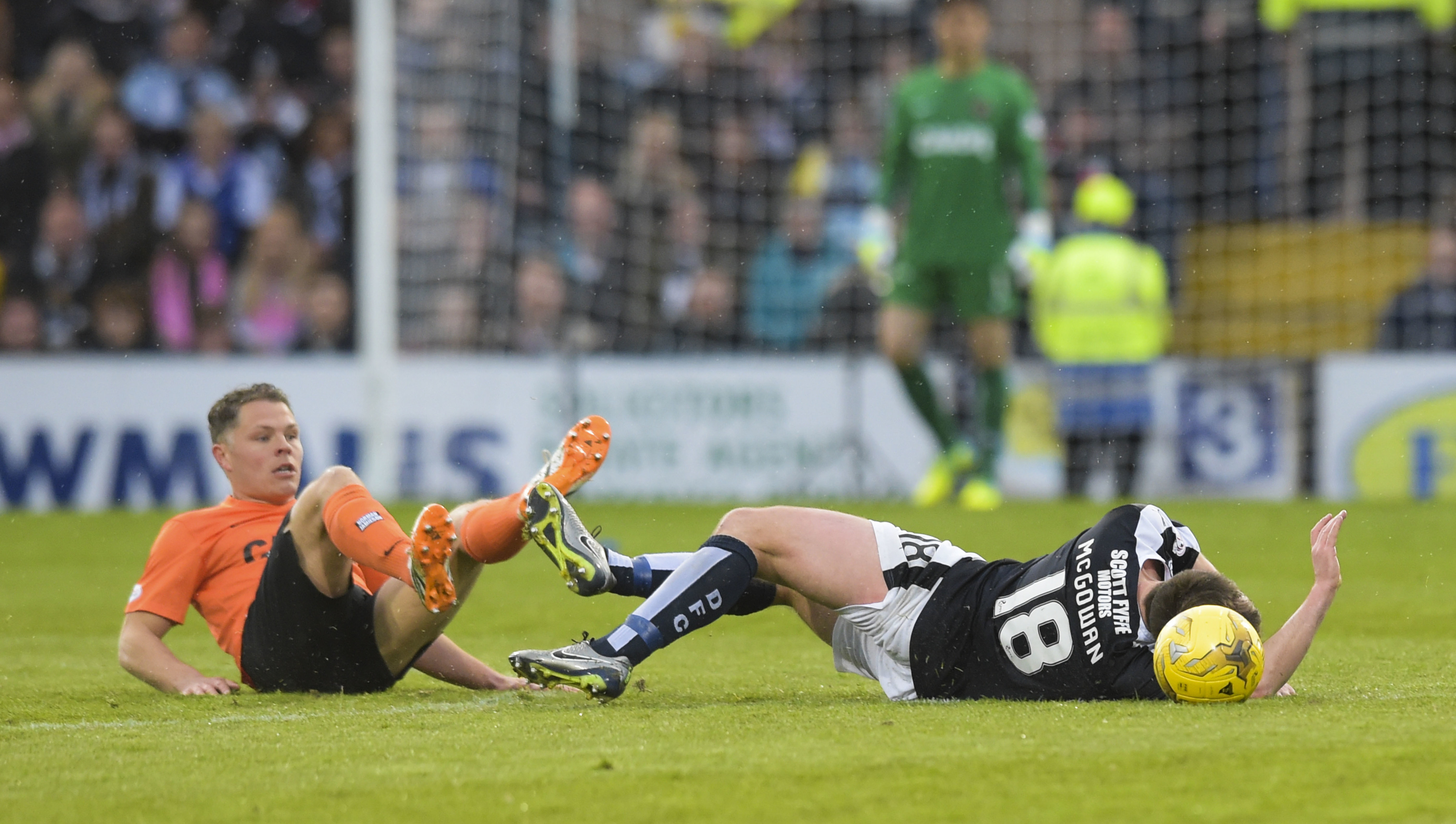 Dundee United's John Rankin challenges Paul McGowan.