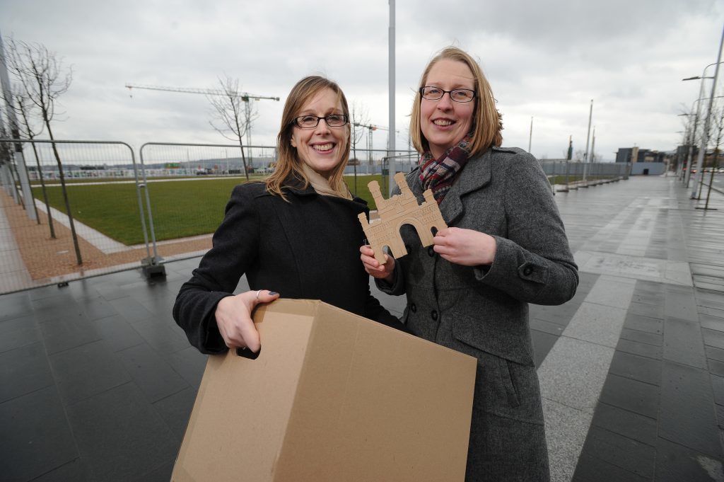 Pictured at Slessor Gardens, site of the original Royal Arch, are Claire and Christine with one of the building blocks of the new and very temporary arch.