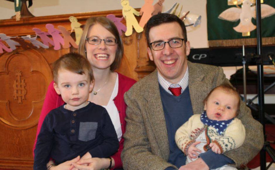 The Rev Stuart Irvin, his wife Lynne and their two young sons.