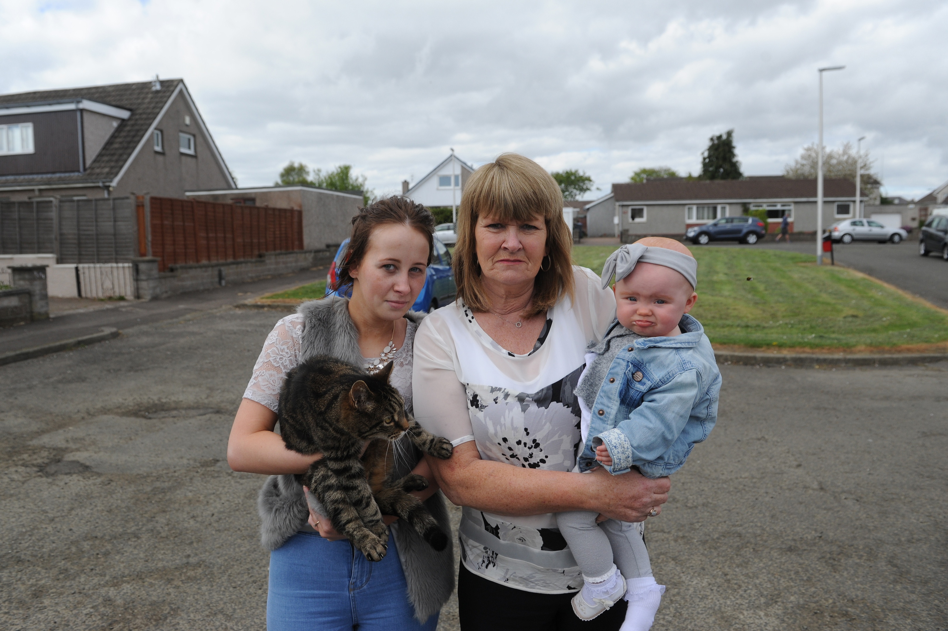 Unhappy with the prospect of a house being built on what they believe is public land are l to r - Rebecca Wood and Laura Black with her grand daughter Harper.