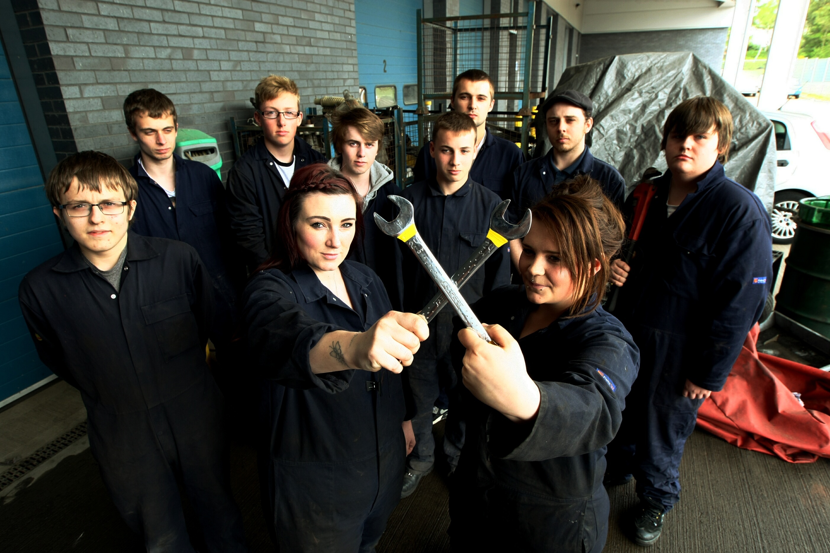 Some of the automotive maintenance students who have signed the petition to save the course.