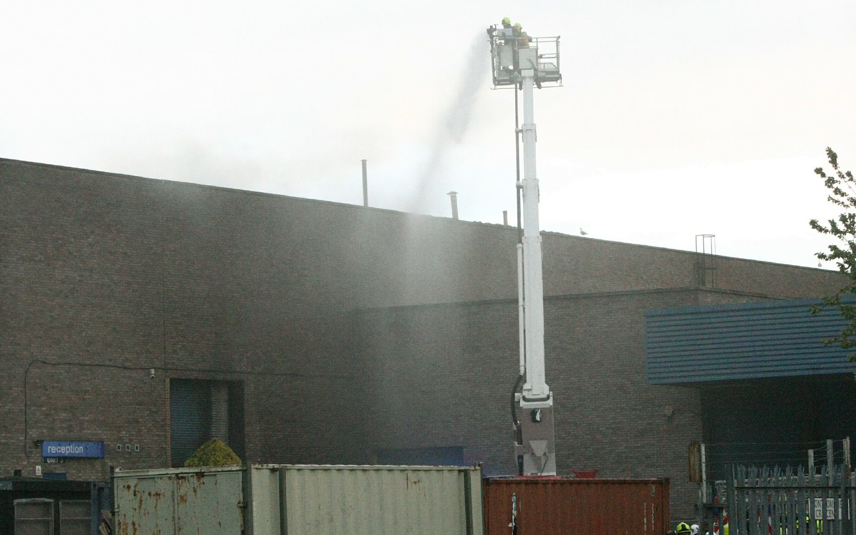 Firefighters tackling the blaze from above.