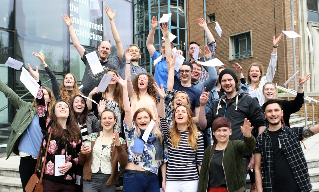 Students celebrating opening their results.