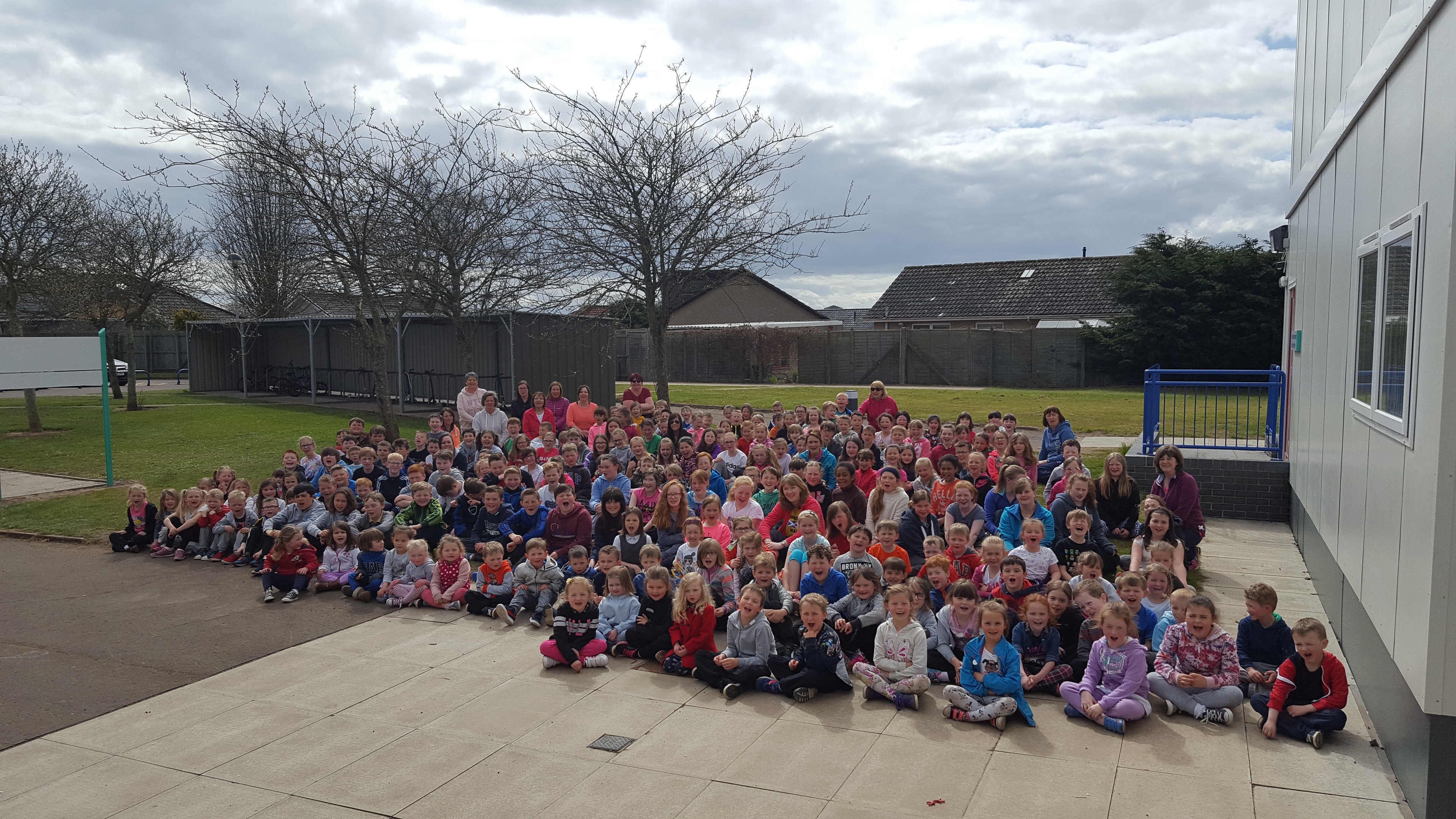 The pupils, parents and staff celebrate their success.