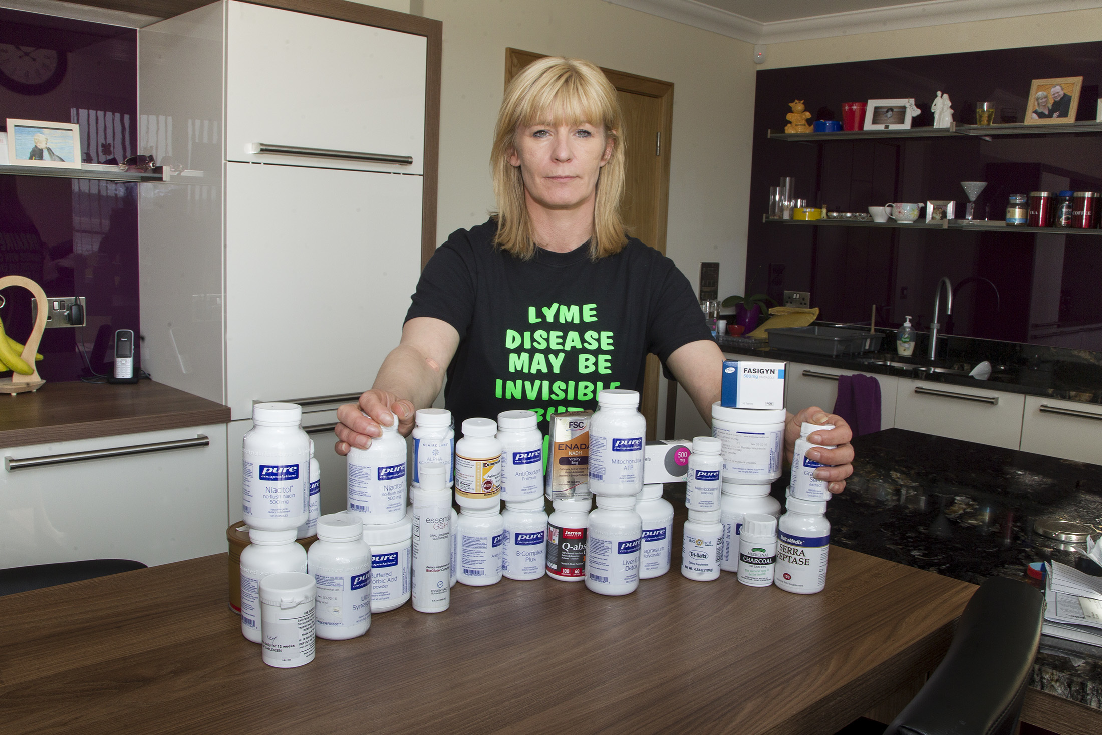Lorraine Murray with a selection of the tablets she now takes to manage her condition.