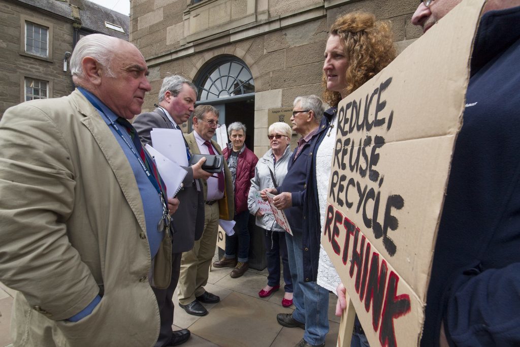 Councillors talking to protesters.