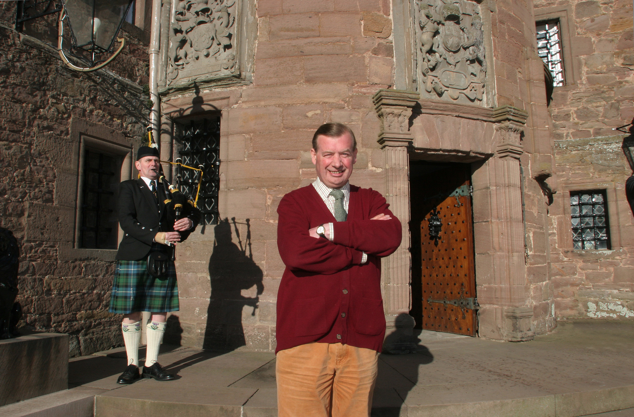 The 18th Earl of Strathmore and Kinghorne, Michael Fergus Bowes-Lyon with Forfar piper David Myles.