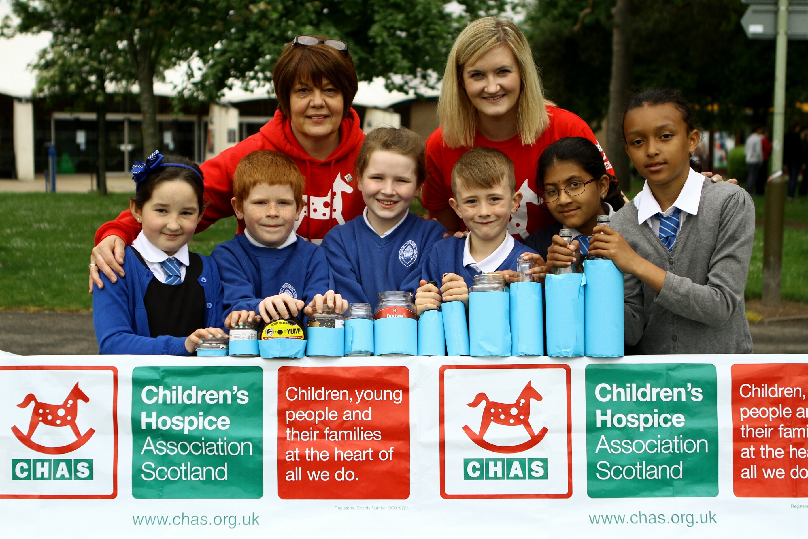 Primary 3/4 pupils from St. Ninian's Episcopal Primary School, Ryley Mitchell, Ethan Hutchison, Sophie Selby-Leslie, Andrew Milne, Sathu Enkahthi and Sarah Bozic with their 'bottle graph' and Alison Rennie and Sarah Dannfeld - community fundraisers with CHAS.