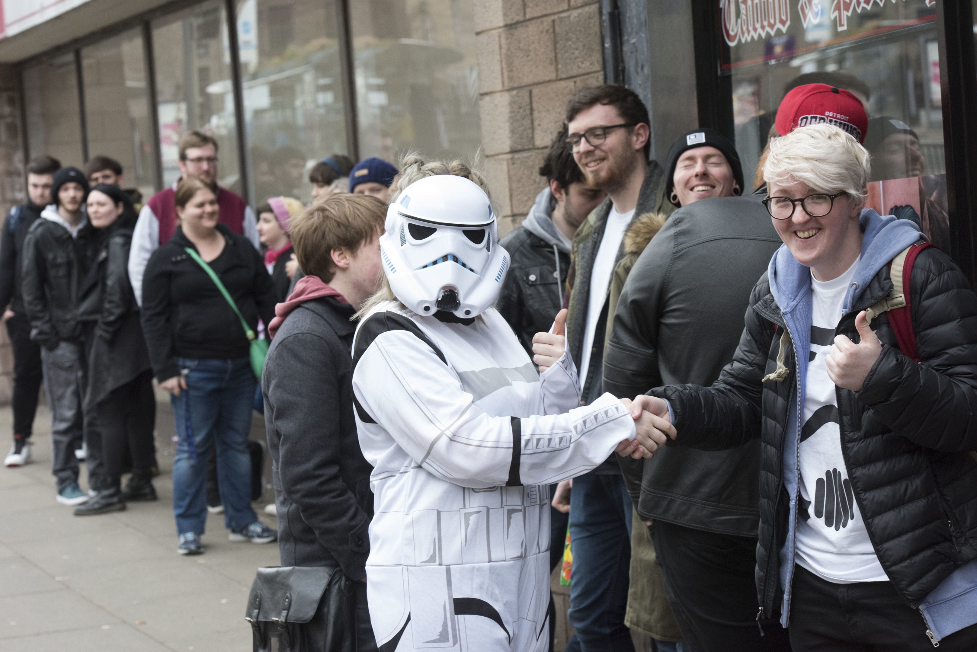 Fans gather outside Rock n Roll Tattoo and Piercing and are greeted by a stormtrooper.