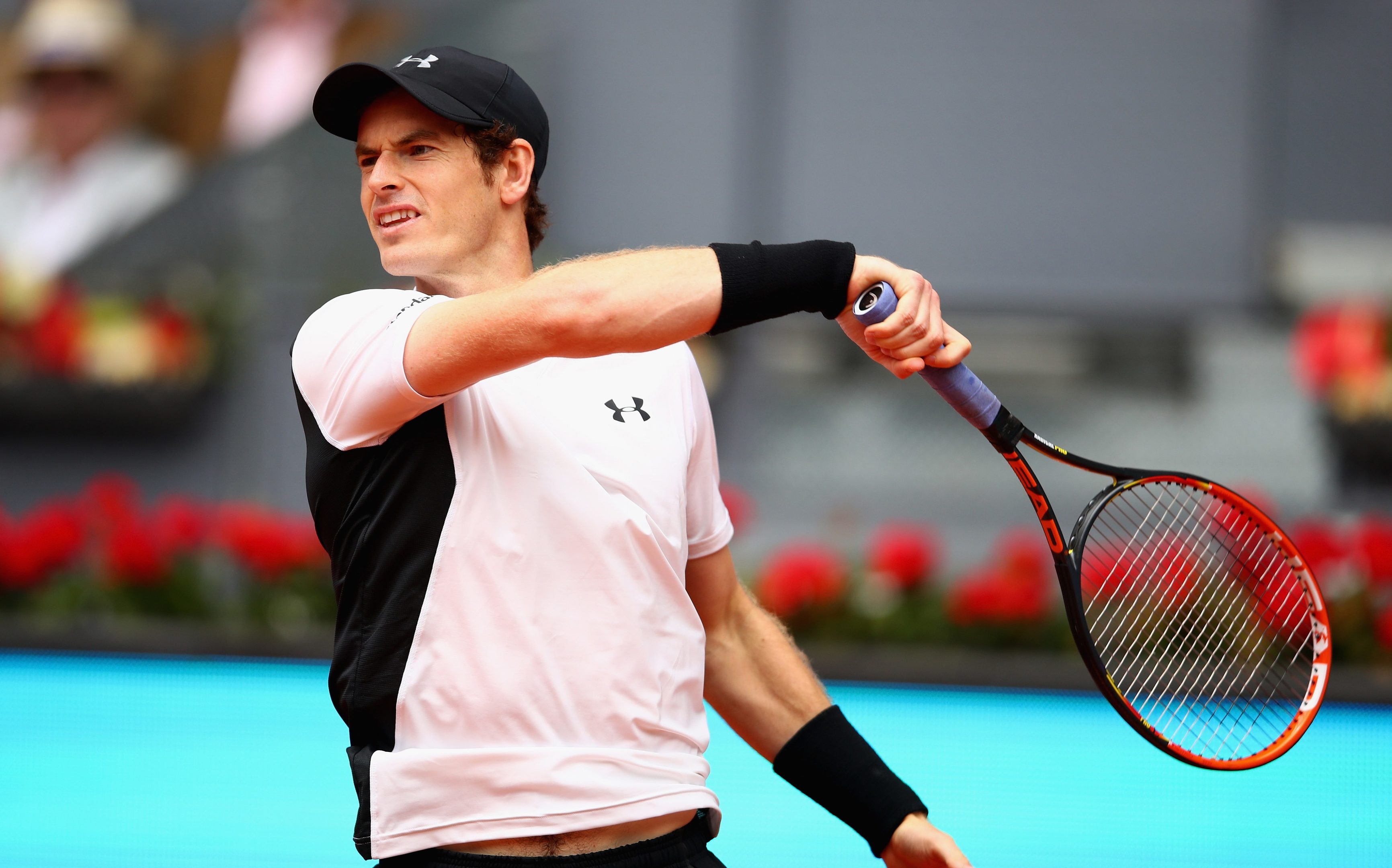 Andy Murray in action against Gilles Simon  in their third round match in the Mutua Madrid Open.