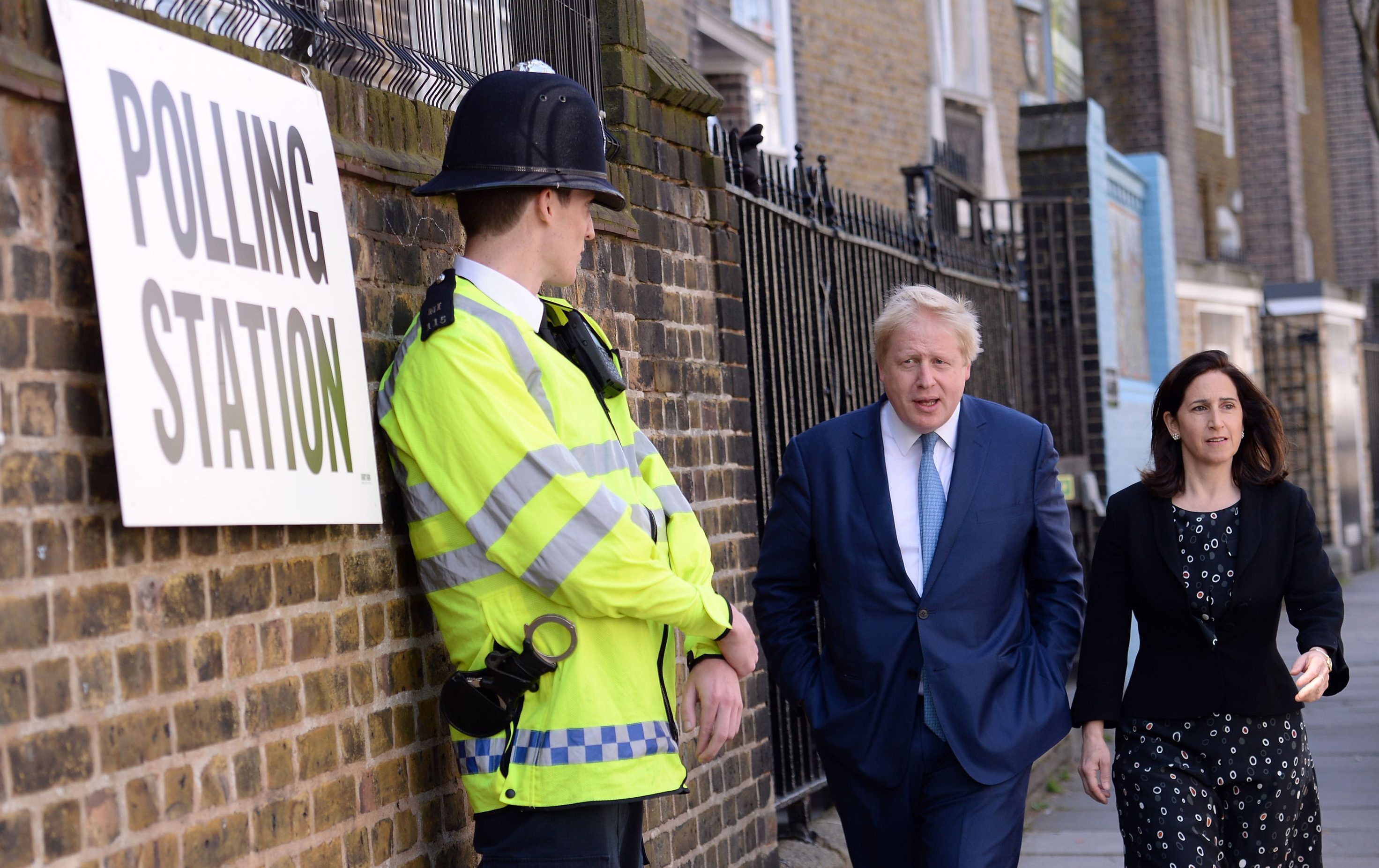 Outgoing London mayor Boris Johnson and wife Marina arrive to cast their votes in London on Thursday.