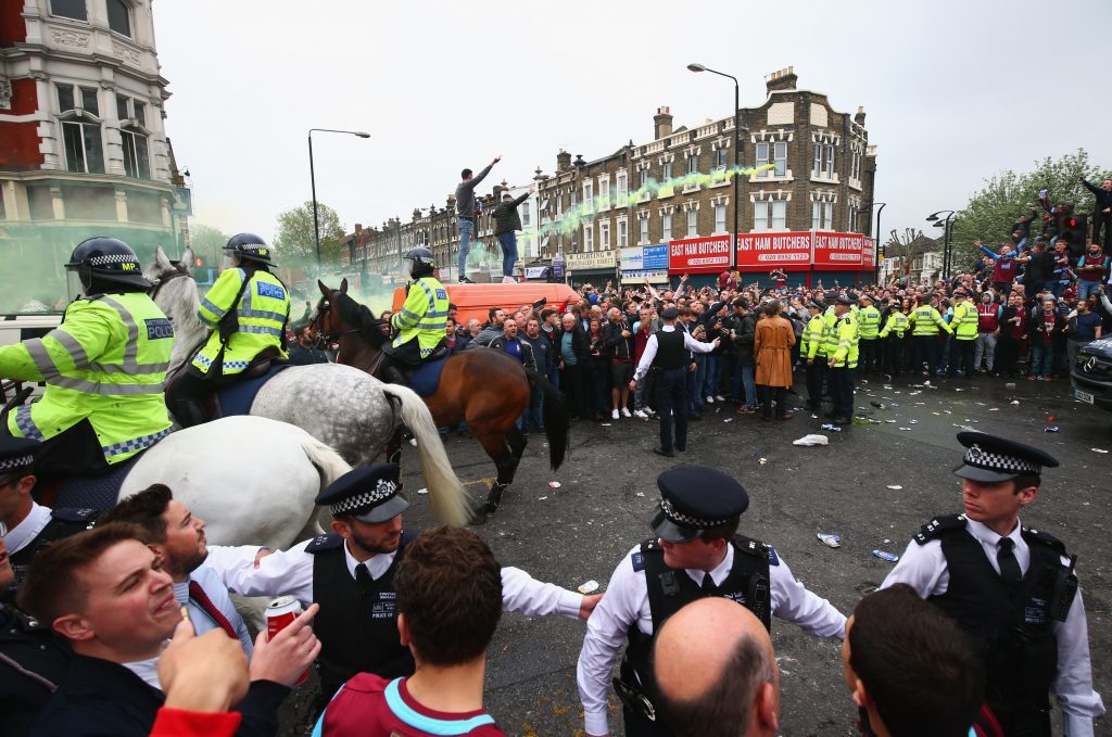 Police on patrol as fans enjoy the atmosphere outside the stadium prior to the Barclays Premier League match between West Ham United and Manchester United at the Boleyn Ground on May 10, 2016 in London, England. West Ham United are playing their last ever home match at the Boleyn Ground after their 112 year stay at the stadium. The Hammers will move to the Olympic Stadium for the 2016-17 season. (Photo by Paul Gilham/Getty Images)