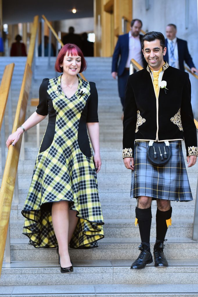 Angela Constance and Humza Yousaf of the SNP walk down the garden lobby steps after being sworn in at the Scottish Parliament.