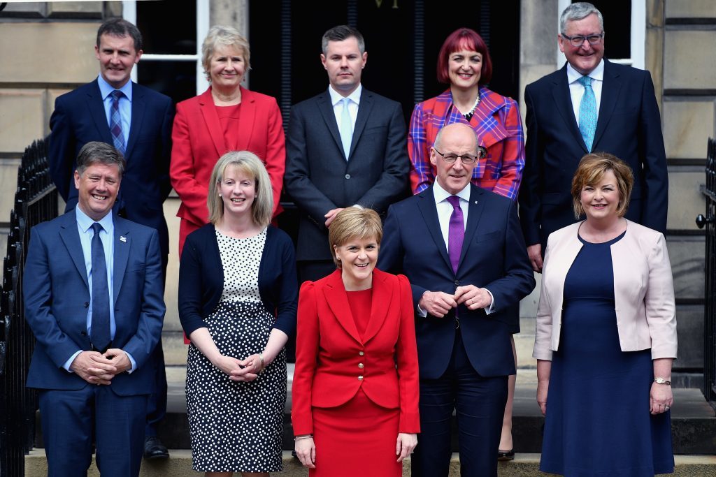 Nicola Sturgeon front, centre) stands on the steps of Bute House with her new cabinet: Michael Matheson Justice Secretary, Roseanna Cunningham Cabinet Secretary for Environment, Climate Change and Land Reform, Derek Mackay Finance Secretary, Angela Constance Cabinet Secretary for Communities, Social Security and Equalities, Fergus Ewing Rural Economy and Connectivity Secretary, Keith Brown economy secretary, Shona Robison Health Secretary, John Swinney Education Secretary and Fiona Hyslop continues as the Culture, Tourism and External Affairs Secretary.