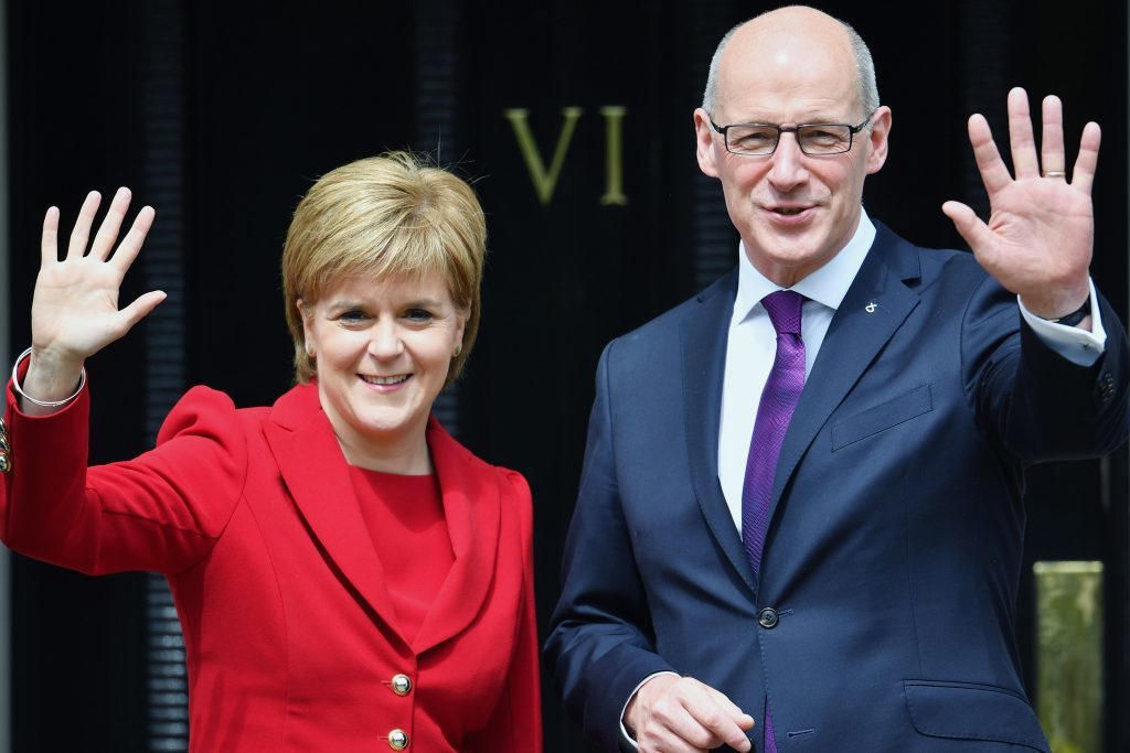First Minister Nicola Sturgeon and her Deputy First Minister John Swinney .