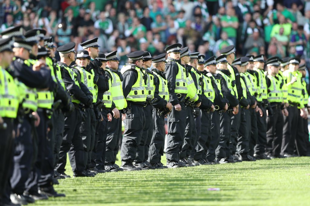 GLASGOW, SCOTLAND - MAY 21: Police form a cordon as Hibs fans invade the pitch at the final whistle after winning the Scottish Cup Final between Rangers and Hibernian at Hampden Park on May 21, 2016 in Glasgow, Scotland. (Photo by Ian MacNicol/Getty)