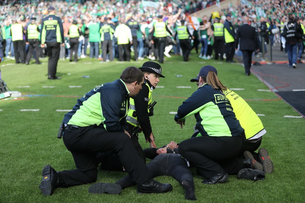 GLASGOW, SCOTLAND - MAY 21:  Hibs fans invade the pitch at the final whistle after winning the Scottish Cup Final between Rangers and Hibernian at Hampden Park on May 21, 2016 in Glasgow, Scotland. (Photo by Ian MacNicol/Getty)