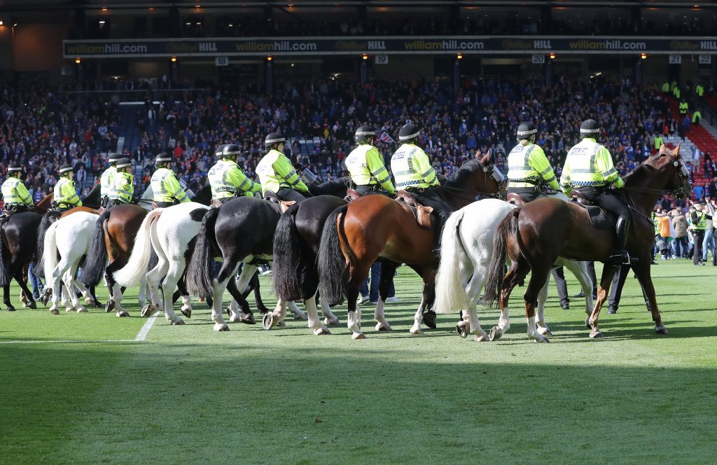 GLASGOW, SCOTLAND - MAY 21: Mounted Police arrive as Hibs fans invade the pitch at the final whistle after winning the Scottish Cup Final between Rangers and Hibernian at Hampden Park on May 21, 2016 in Glasgow, Scotland. (Photo by Ian MacNicol/Getty)