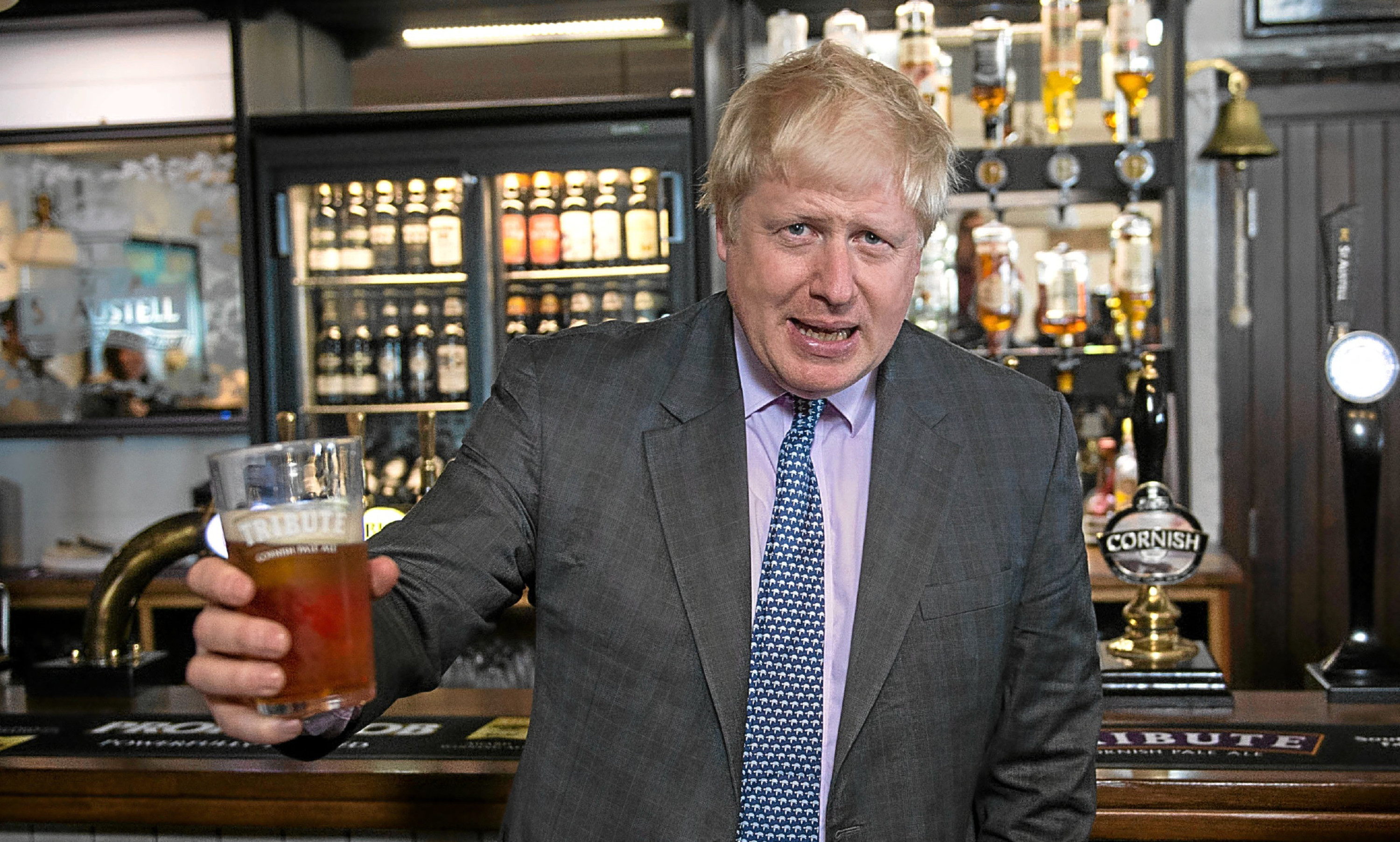 Former Mayor of London Boris Johnson drinks a pint of beer on a visit to the St Austell Brewery in Cornwall, during a Vote Leave campaign visit.