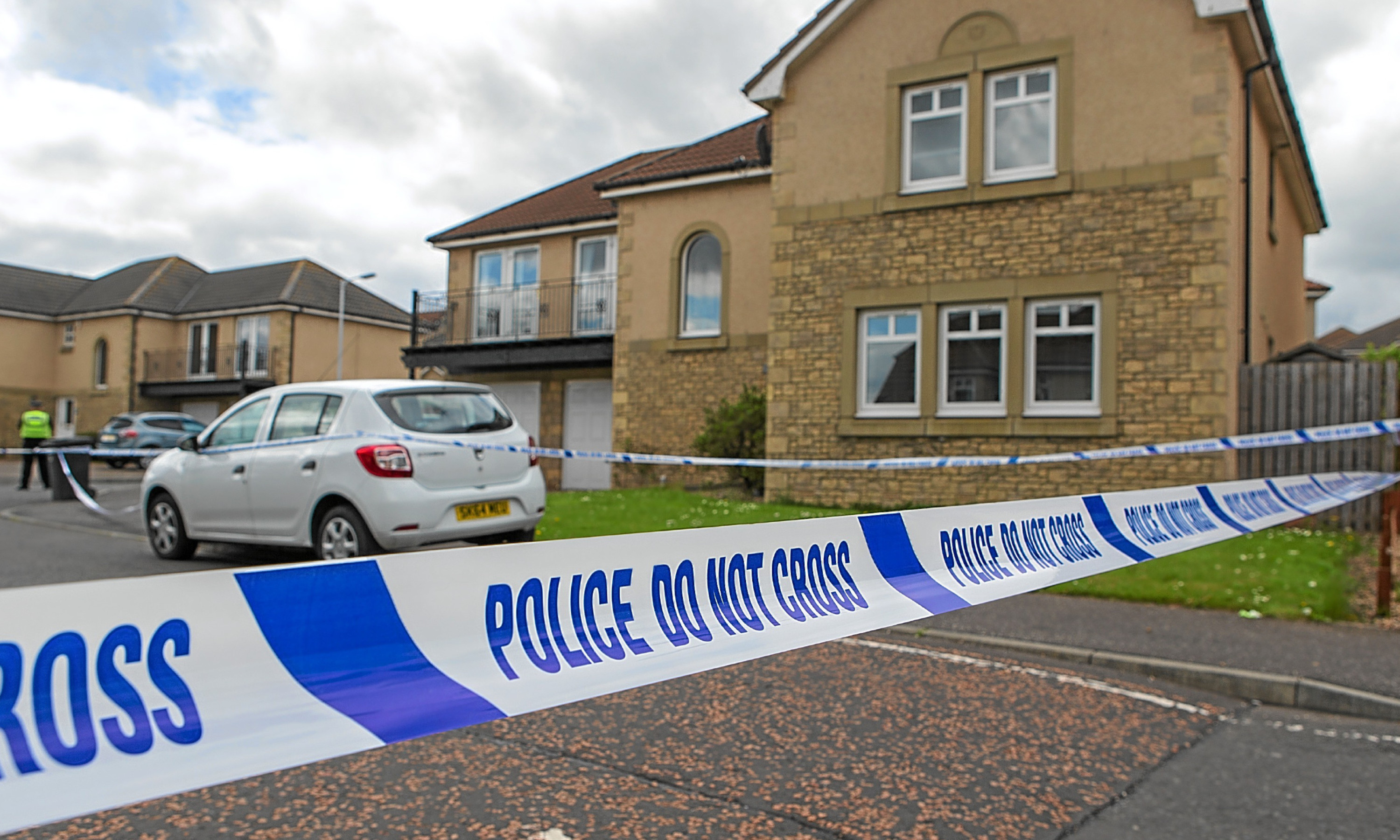 Police cordoned off the house after the gun incident.