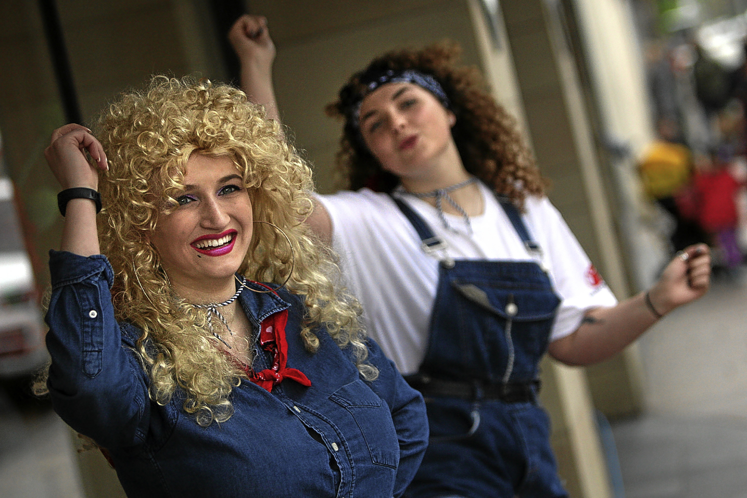 Kris Miller, Courier, 28/05/16. Picture today in Brook Street, Broughty Ferry where a Dolly Parton danceathon took place with a sponsored 8 hour long Dance-a-Thon in aid of Save The Children. We are dancing for 8 hours non-stop from 9am-5pm to Country music dressed as Dolly Parton outside Gillies! (even dancing when eating, nipping to the loo and drinking!) Pic shows Martha Gardiner and Julia Burns dance