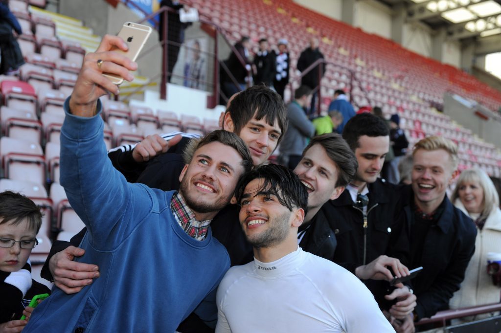 Faissal El Bakhtaoui celebrates with fans.